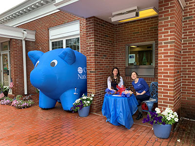 Ralitsa and Kurri Sitting at a Decorated Table