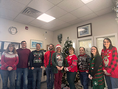 Group of People Wearing Christmas Sweaters