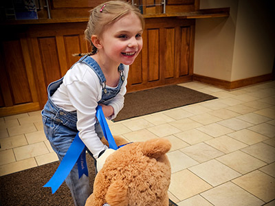 Beverly with Large Stuffed Teddy Bear