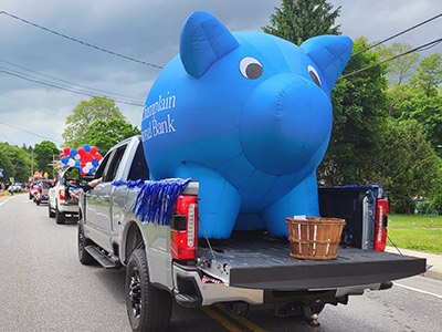 Inflatable Piggy Bank in the Back of a Truck