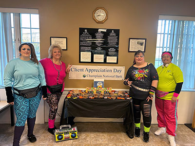 Jayne, Michelle, April, and Amanda Standing Next to Treats Table