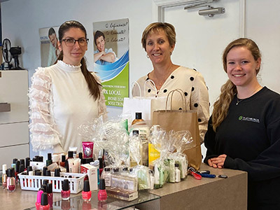 Three Women Standing with Hygiene Items