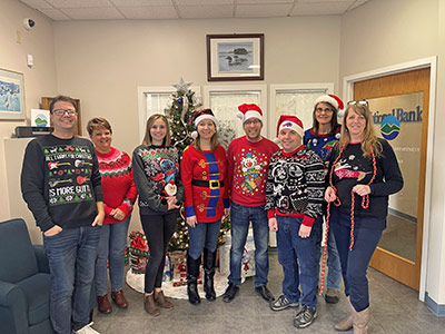 Group of People Wearing Holiday Sweaters