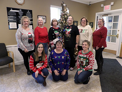 Group of People Wearing Christmas Sweaters